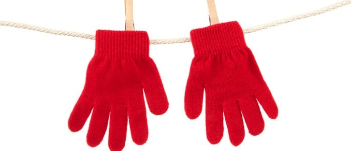 red-winter-gloves-on-clothesline-studio-isolated-picture-id175264790