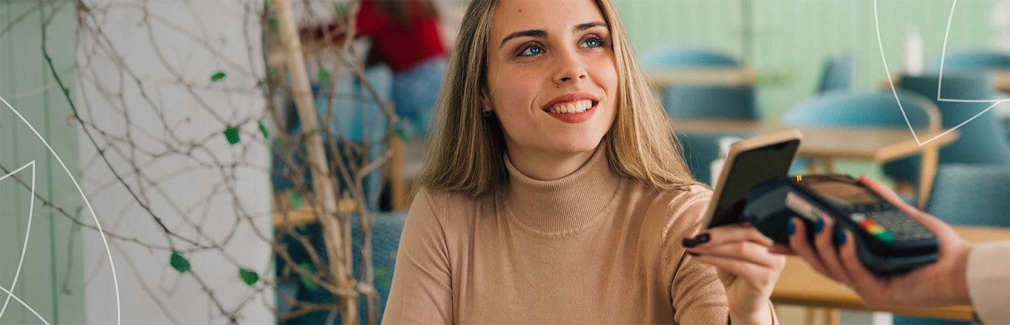 Woman smiling holding a phone
