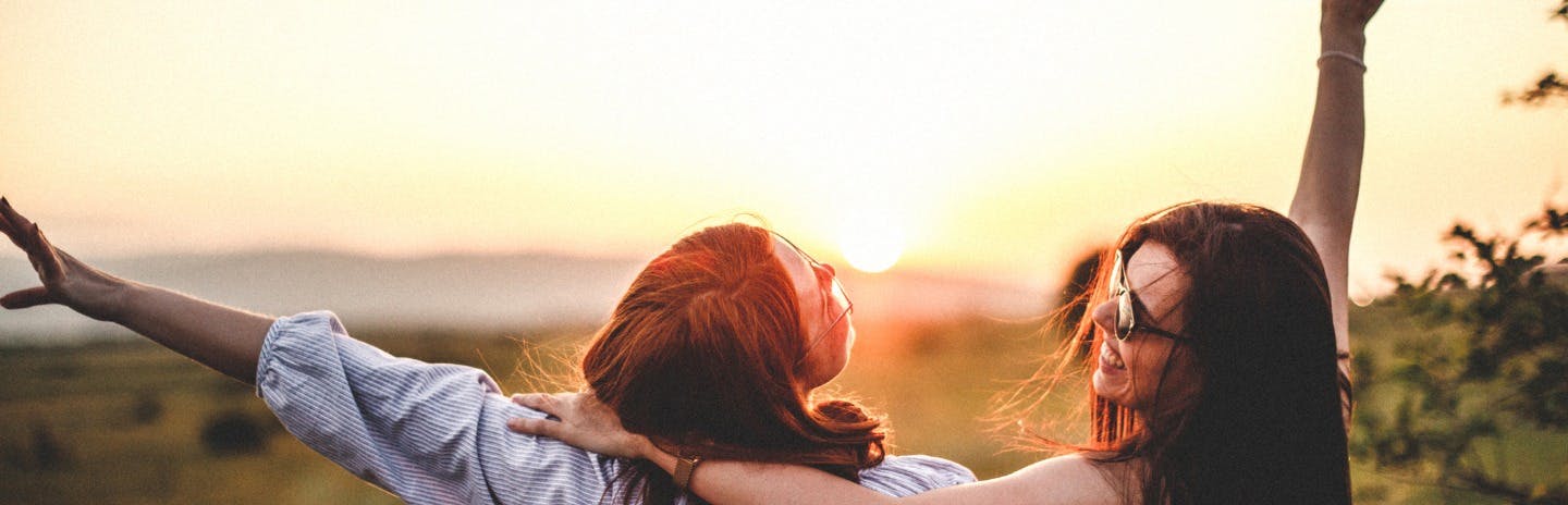 teen-girls-look-at-the-sunset-picture-id965580802